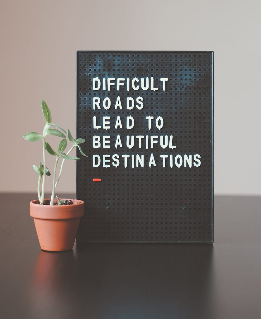 Magnetic sign with the words "Difficult roads lead to beautiful destinations"